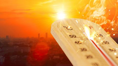 Explodierender Thermometer, Glas zerspringt vor Städtelandschaft