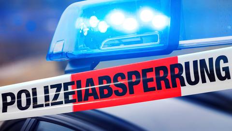 Blaulicht und Schriftzug "Polizeiabsperrung"