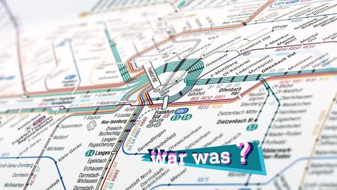 Foto eines Streckennetzplanes des RMV. Auf dem Foto eine kleine farbige Grafik mit dem Schriftzug "War was?".