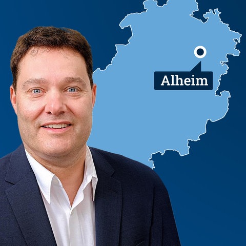 Karte von Hessen mit dem Ort Alheim, daneben Portrait Jochen Schmidt.