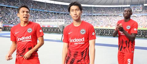 Enttäuschung bei Makoto Hasebe, Daichi Kamada und Randal Kolo Muani nach Abpfiff