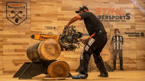 German champion sports lumberjack Danny Maher uses a high-performance chainsaw