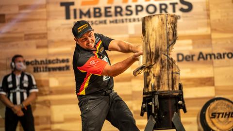 Sports lumberjack Danny Maher hits in the German championship